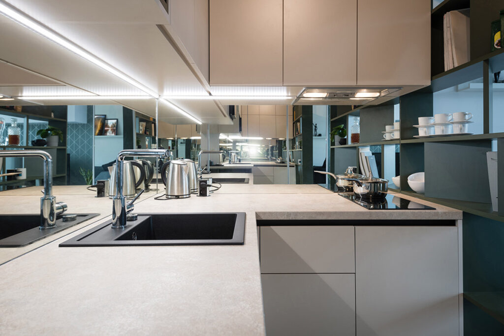 Galley Kitchen Remodeling Ideas for Condo Living in Dane County Under-cabinet lighting in a modern apartment's galley kitchen.