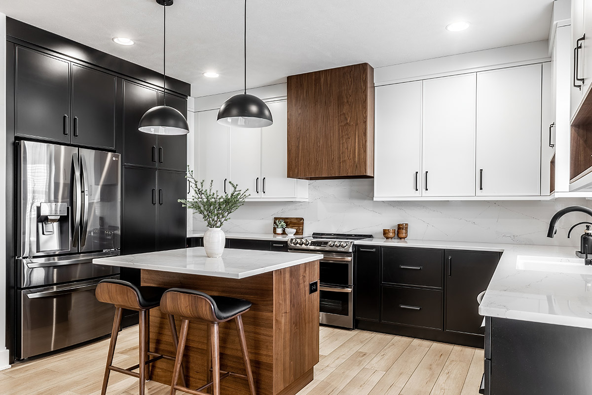 A bright modern galley kitchen with glass-front cabinetry.